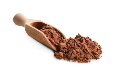 Heap of cocoa powder and wooden scoop on white background
