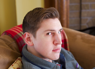 Obraz premium Young man home from college for the holidays