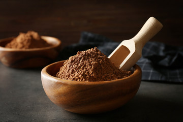 Bowl with cocoa powder, closeup