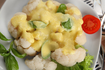 Plate with delicious cauliflower and cheese sauce, closeup