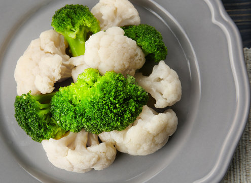 Delicious cauliflower and broccoli on grey plate