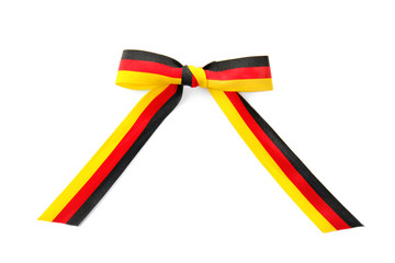 Ribbon bow in colors of German flag on white background