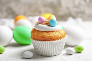 Sweet Easter cupcake on linen tablecloth
