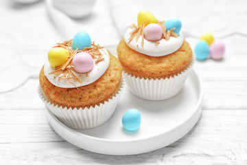 Fantastic Easter cupcakes on white wooden table