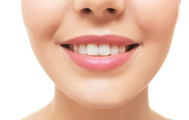 Smiling young woman on white background, closeup