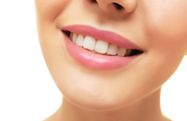 Smiling young woman on white background, closeup