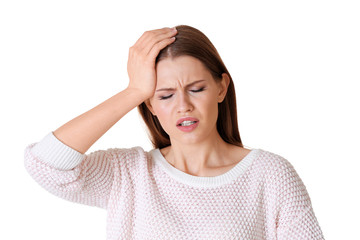 Beautiful young woman suffering from headache on white background