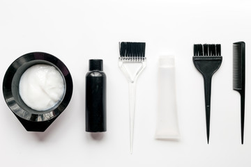 barbershop concept with hairdye tools on white background top view