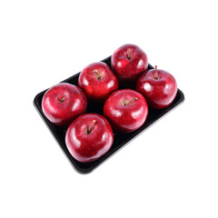 six red apples on black tray isolated on white