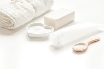 Obraz na płótnie Canvas body care concept with white set of cosmetics woman desk top view
