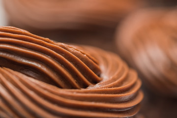 Close up of chocolate frosting on a cupcake