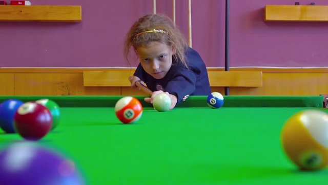 Happy Girl Playing Snooker At Home. Slow motion
