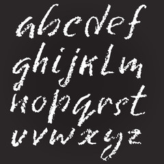 Handwritten vector chalked alphabet. Imitation texture of chalk. Modern hand drawn alphabet. Isolated letters. Vector illustration