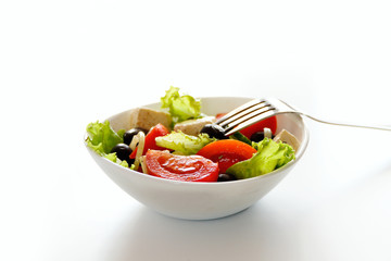Fresh vegetable salad isolated on white background. Selective focus and space for text
