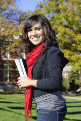 Fototapeta premium Female Latino college student on campus