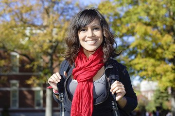 Female Latino college student on campus
