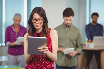 Business executives using digital tablet