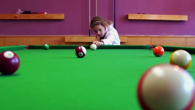 Happy Girl Playing Snooker At Home. 