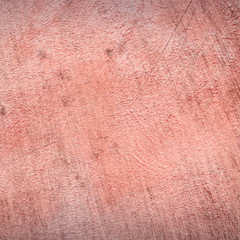 Abstract Background of a concrete wall fragment in red color