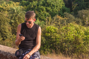 Young man with mobile phone, Goa, India