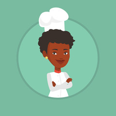Confident female chef with arms crossed.