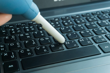 woman hands cleaning laptop computer screen.