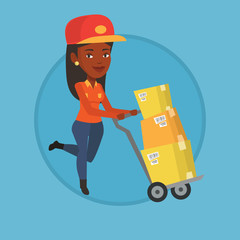 Fototapeta premium Delivery postman with cardboard boxes on trolley.