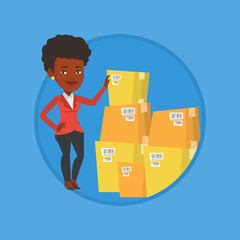 Business woman checking boxes in warehouse.