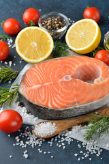 Raw salmon steak and ingredients