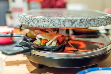 View of Family table for cooking on Raclette