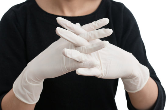 medical white gloves on his hands