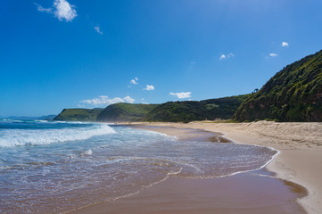 Beautiful ocean coastline with Garie beach and green hills. Australia
