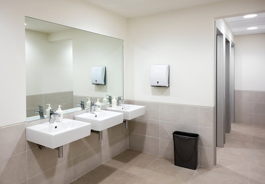 Public bathroom or restroom with hand basins