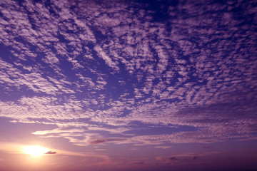 Pattern of white clouds streaming by wind with blue sky background 