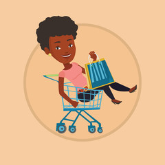 Happy woman riding by shopping trolley.