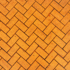 Orange zigzag brick paving texture