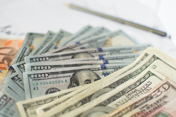 Money dollars and forex charts