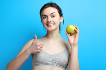 sports girl with an apple