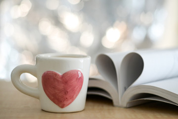 Heart from pages of the book concept love tea coffee. Soft focus