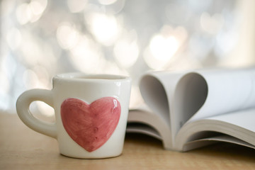 Heart from pages of the book concept love tea coffee. Soft focus