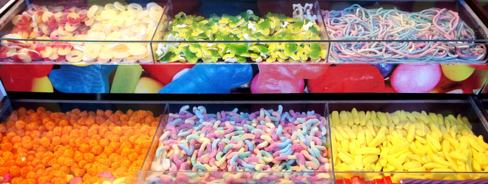 A variety of gummies and worms on store shelves