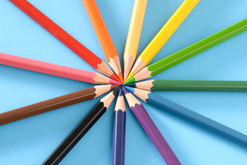 Fototapeta premium Multicolored pencils isolated on blue background