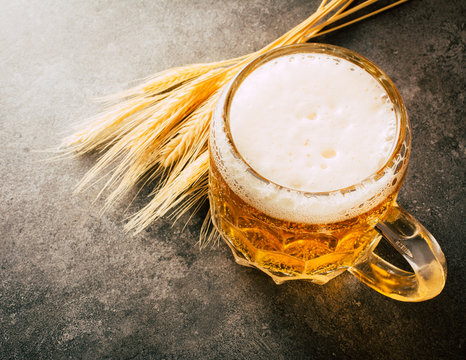 Glass of  beer on stone background with copy space. wallpaper