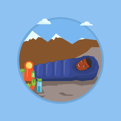 Man sleeping in sleeping bag in the mountains.