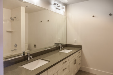 contemporary white bathroom with two sinks