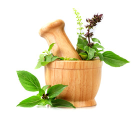 Sweet basil and Holy basil leaves with flower in wooden mortar on white background