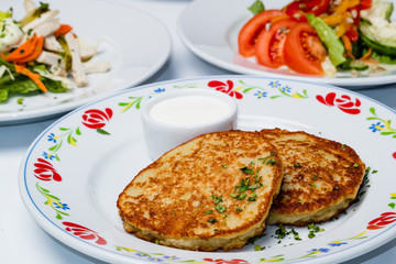 Cutlets from potatoes, national Belarusian dish draniki