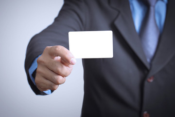 businessman holding a credit card