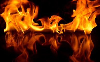 Fototapeta premium Art abstract fire flame on black background