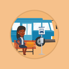 Business woman waiting at the bus stop.